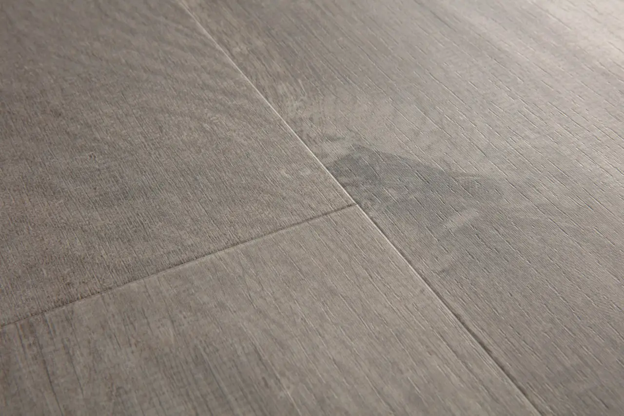 Close-up van de structuur van Quick-Step Bloom Katoen cosygrijze eik