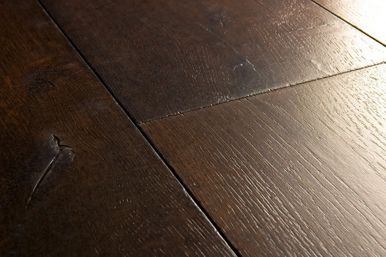 Close-up van de structuur van Quick-Step Capture Gewaxte bruine eik