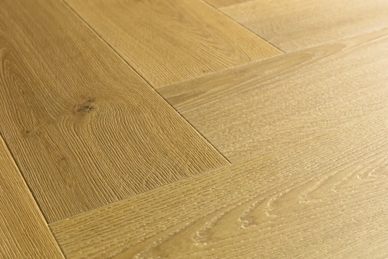 Close-up van de structuur van Quick-Step Impressive Design Komijn eik