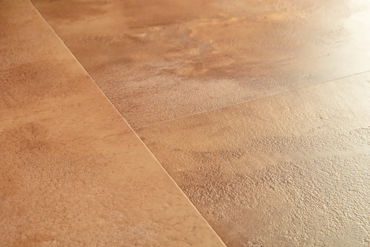 Close-up van de structuur van Quick-Step Muse Terracotta